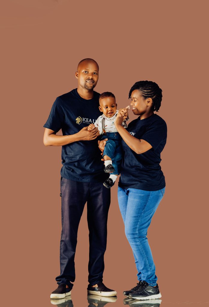 A happy family posing against a brown background, showcasing love and togetherness.
